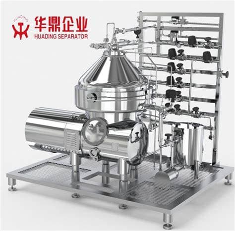 A disc-stack centrifuge separator on a stainless-steel frame.