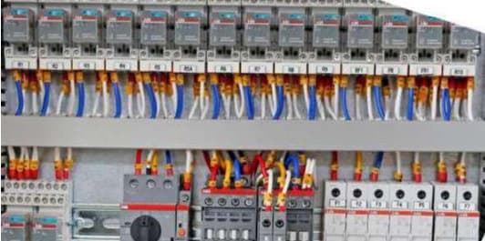 Electrical distribution panel with terminals, breakers and instrumentation wiring.