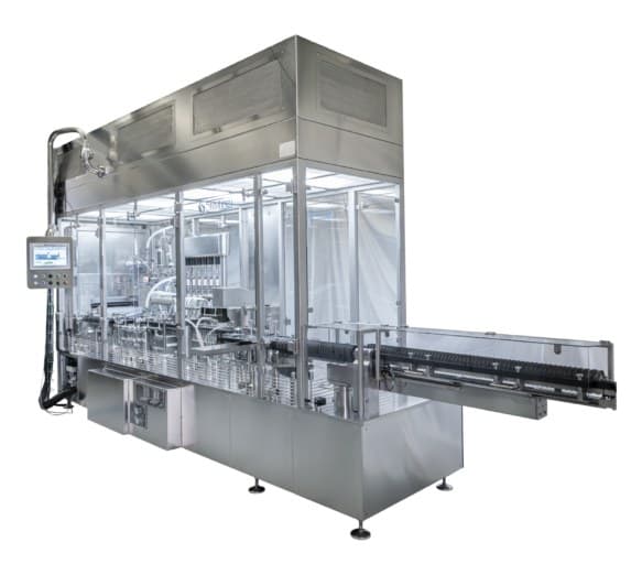 An aseptic filling line with glazed enclosure and stainless-steel conveyor.